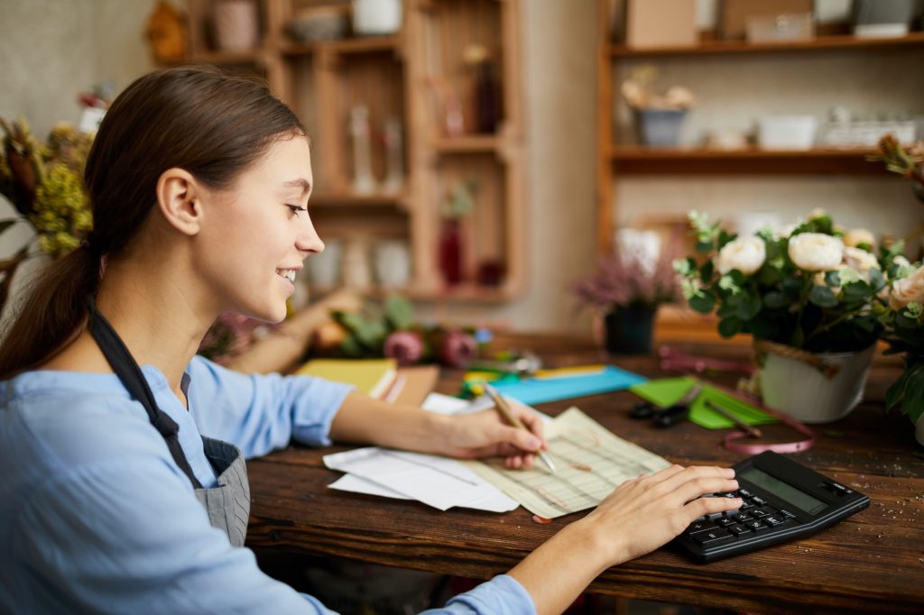 Woman doing Accounting in Shop